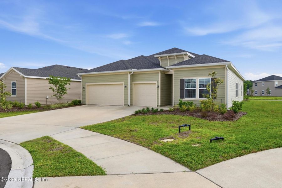 Front exterior of a new home in Saddle Oaks, Jacksonville, FL, highlighting curb appeal (Image 26). Front exterior of a new home in Saddle Oaks, Jacksonville, FL, highlighting curb appeal (Image 26).