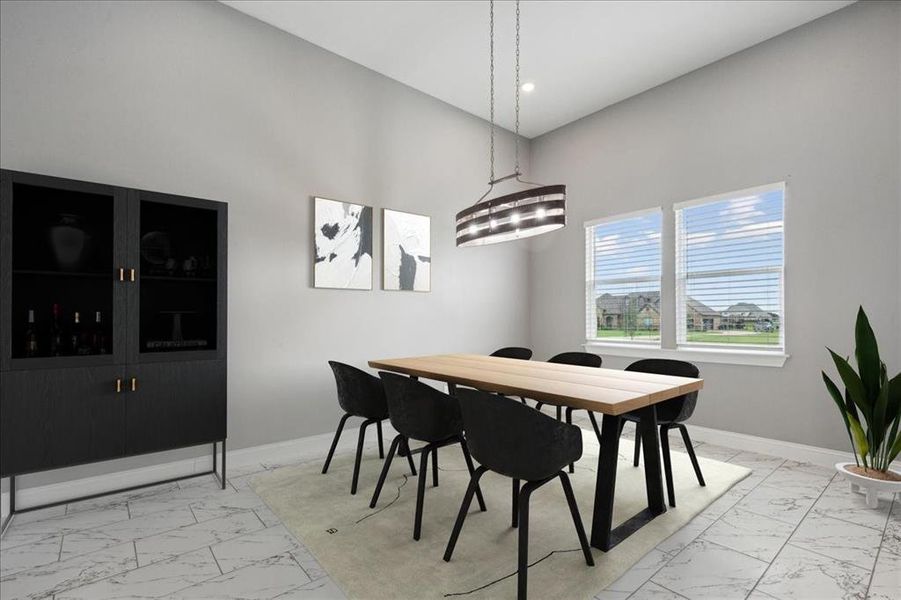 Dining space with marble finish floor, baseboards, and recessed lighting