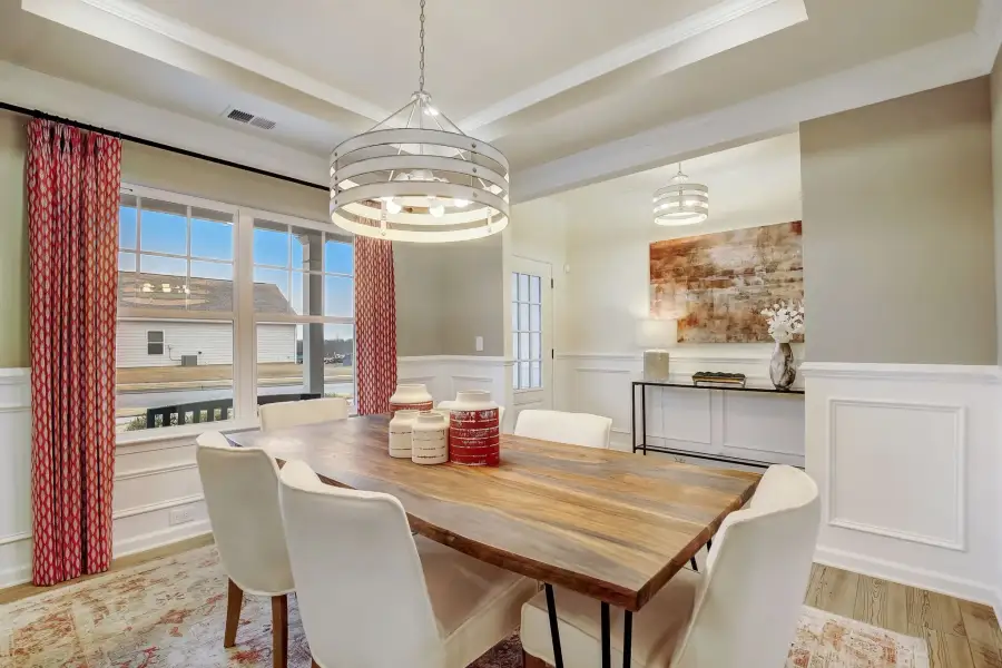 The Palmer- Dining Room with Tray Ceiling. The sample image is a staged model, to be used for illustrative purposes only. Upgrades, options, and colors will vary.