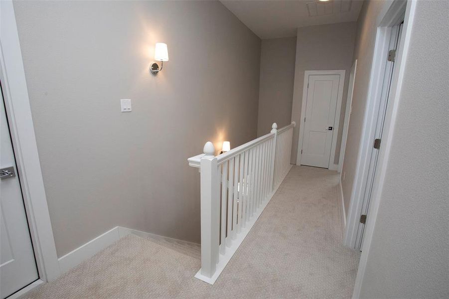 Upstairs entrance to attic storage and 2 bedrooms/baths