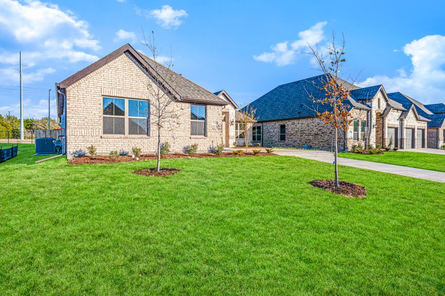 Front exterior of a new home in Forest Ridge Estates, Greenville, TX, highlighting curb appeal (Image 21).