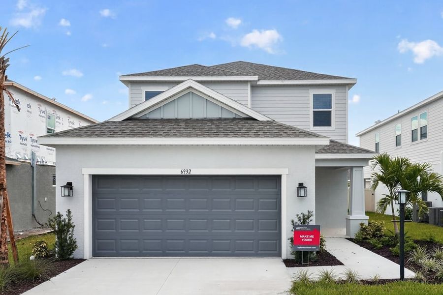 Front exterior of a new home in Tiburon, Nokomis, FL, highlighting curb appeal (Image 1). Front exterior of a new home in Tiburon, Nokomis, FL, highlighting curb appeal (Image 1).