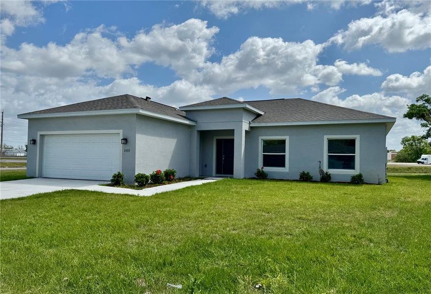 Front exterior of a new home in , Orlando, FL, highlighting curb appeal (Image 1).