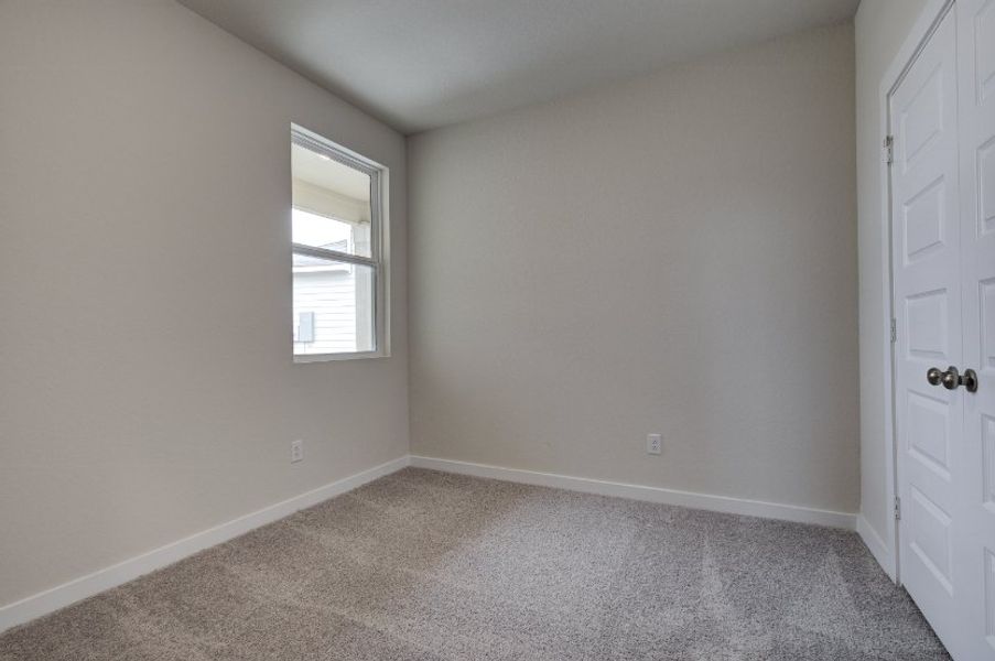 A room with a door and a window. A room with a door and a window.