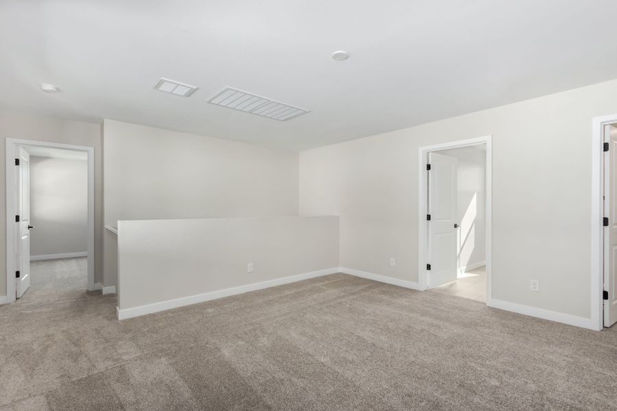 Spacious, unfurnished interior of a new home in Solvida at Estrella, Goodyear (Image 32).