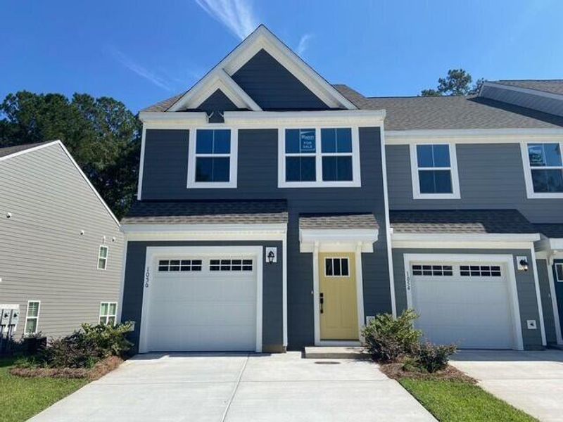 Front exterior of a new home in Crescent Cove, Summerville, SC, highlighting curb appeal (Image 1).