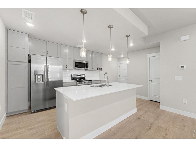 Furnished interior view inside a new home in Highlands at Fox Hill - The Flats, Longmont (Image 10).