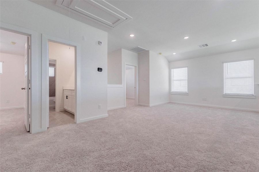 Spacious upstairs game room or flex area with soft carpet, recessed lighting, multiple windows, and an open connection to nearby bedrooms and bath spaces. This large bonus room is ideal for movie nights, play space, gaming, studying, hobbies, or a casual lounge, offering valuable flexibility for today’s lifestyle. Spacious upstairs game room or flex area with soft carpet, recessed lighting, multiple windows, and an open connection to nearby bedrooms and bath spaces. This large bonus room is ideal for movie nights, play space, gaming, studying, hobbies, or a casual lounge, offering valuable flexibility for today’s lifestyle.