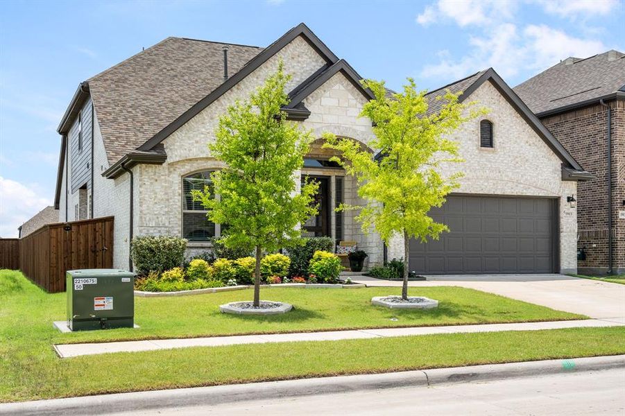 Stone and siding exterior with a two-car garage Stone and siding exterior with a two-car garage
