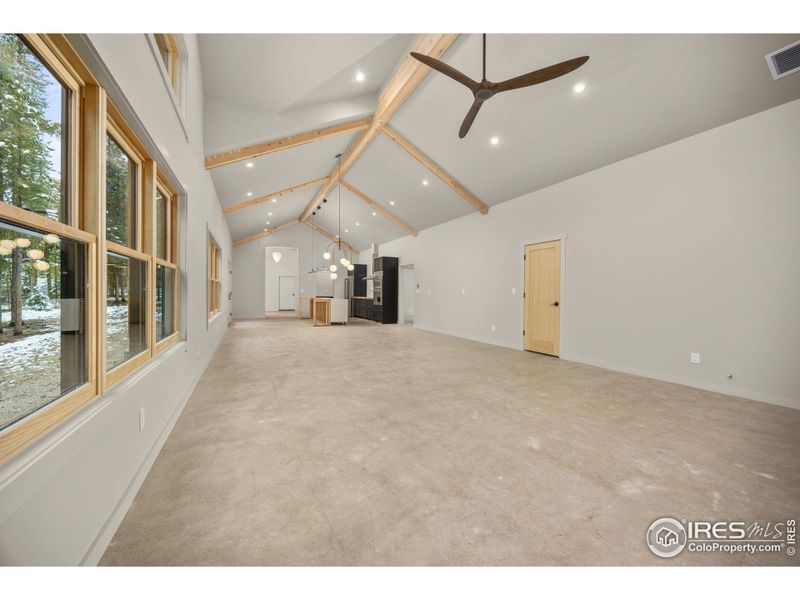 View from living room toward dining room and then kitchen - entire home has concrete floors with radiant heating throughout View from living room toward dining room and then kitchen - entire home has concrete floors with radiant heating throughout
