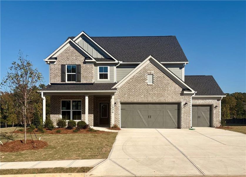 Front exterior of a new home in Riversprings, Dacula, GA, highlighting curb appeal (Image 1). Front exterior of a new home in Riversprings, Dacula, GA, highlighting curb appeal (Image 1).