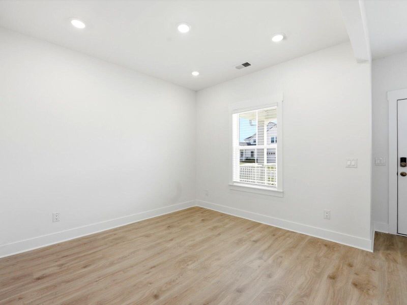 Spacious, unfurnished interior of a new home in The Coves at Lakes of Cane Bay II, Summerville (Image 29).