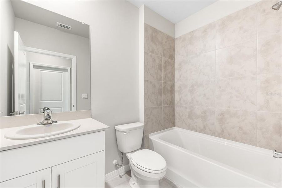 Furnished interior view inside a new home in Cove at West Port - Tradition, Port Charlotte (Image 10).