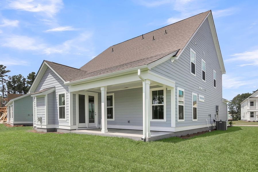 Front exterior of a new home in Tidewater at Lakes of Cane Bay, Summerville, SC, highlighting curb appeal (Image 23).