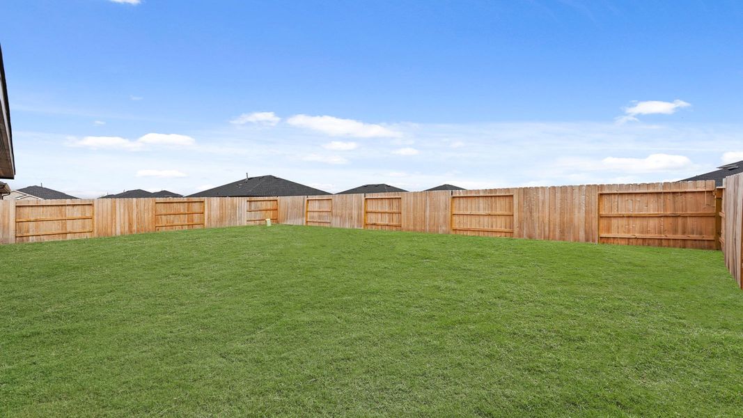 Exterior details and patio area of a home in Sunterra, Katy (Image 3).