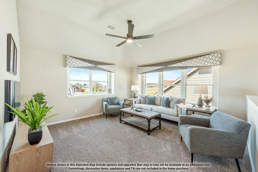Living room with vaulted ceiling, ceiling fan, carpet flooring, and large windows with decorative valances