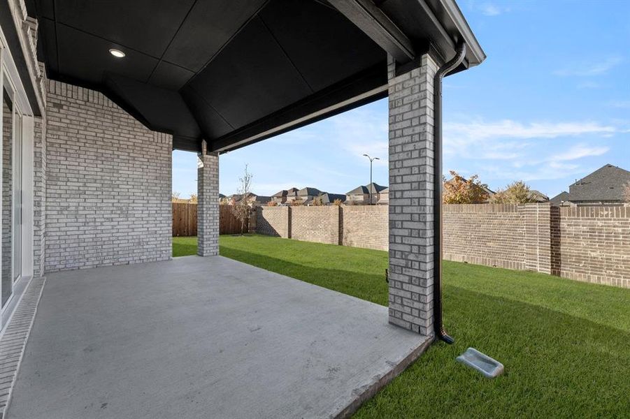 Exterior details and patio area of a home in Valencia on The Lake, Little Elm (Image 3).