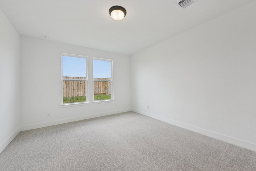 Representative unfurnished interior of a home built from the Hoyt by Risewell Homes in The Canopies, Splendora (Image 10).