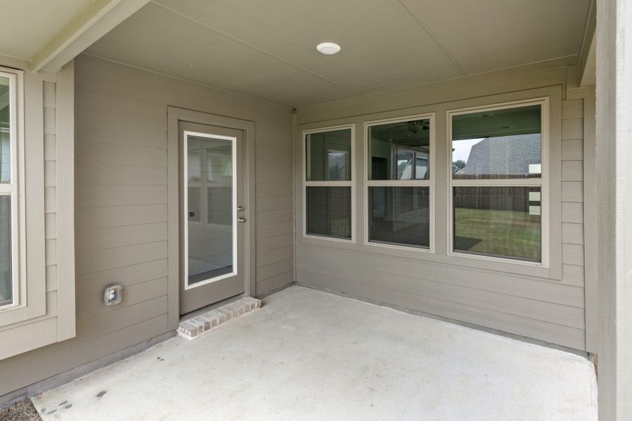 Exterior details and patio area of a home in Keeneland, Aubrey (Image 18).