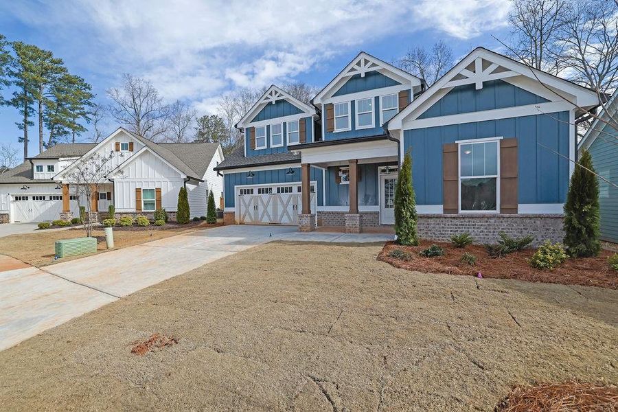 Front exterior of a new home in , Holly Springs, GA, highlighting curb appeal (Image 26).