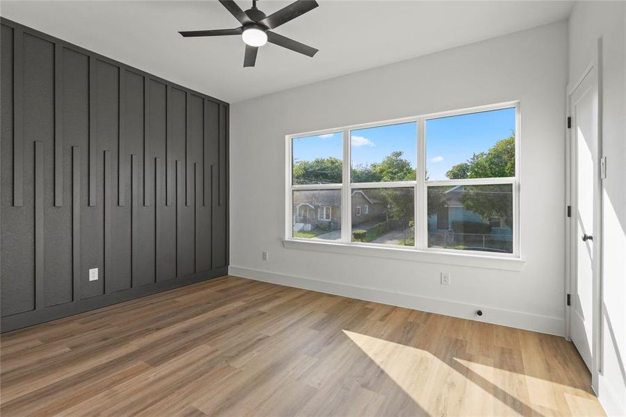 Unfurnished bedroom featuring light wood finished floors and ceiling fan