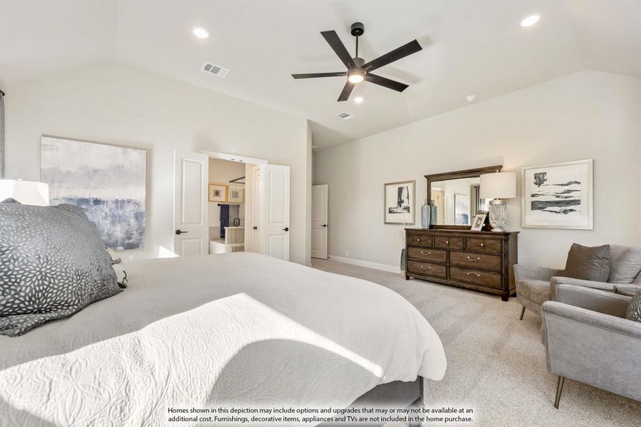 Spacious master bedroom with ceiling fan, carpet flooring, wood dresser, and open ensuite bathroom door Spacious master bedroom with ceiling fan, carpet flooring, wood dresser, and open ensuite bathroom door