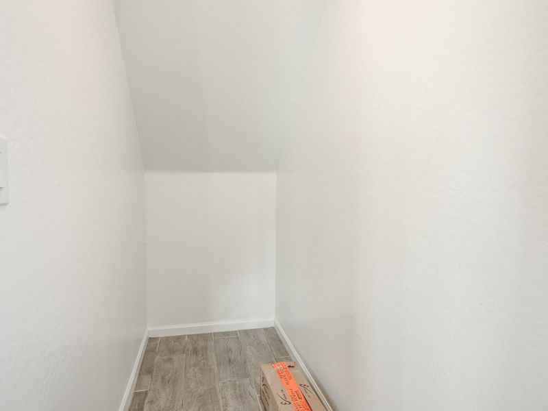 A hallway with white walls. A hallway with white walls.