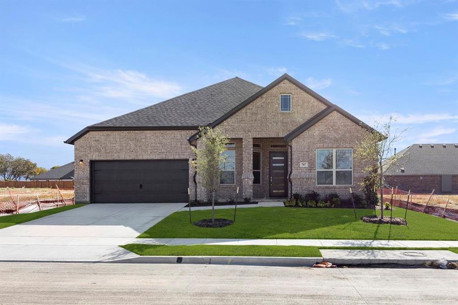 Front exterior of a new home in River Ranch, Van Alstyne, TX, highlighting curb appeal (Image 2). Front exterior of a new home in River Ranch, Van Alstyne, TX, highlighting curb appeal (Image 2).