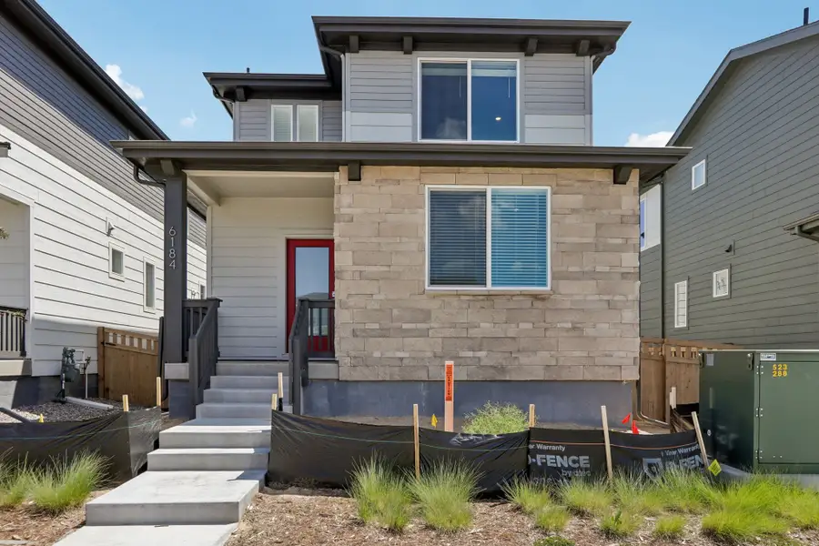 Exterior details and patio area of a home in Woodrose at Painted Prairie, Aurora (Image 1). Exterior details and patio area of a home in Woodrose at Painted Prairie, Aurora (Image 1).