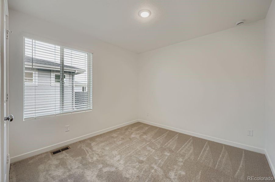 Spacious, unfurnished interior of a new home in Percheron: The Explorer Collection, Colorado Springs (Image 11).