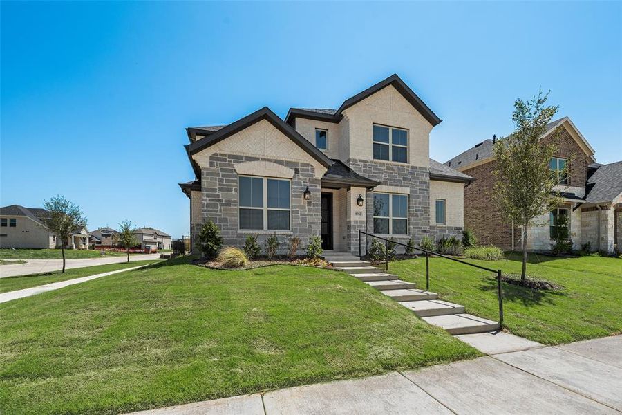 Front exterior of a new home in Villages of Creekwood, Frisco, TX, highlighting curb appeal (Image 15). Front exterior of a new home in Villages of Creekwood, Frisco, TX, highlighting curb appeal (Image 15).