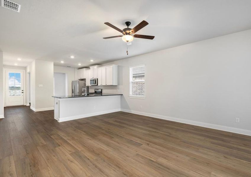 The kitchen overlooks the living room so you never miss out on conversation and fun.