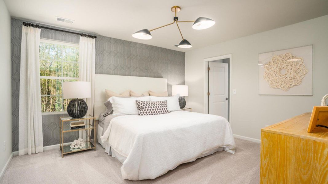 Furnished interior view inside a new home in Lindera Preserve at Cane Bay Plantation: American Dream Series, Summerville (Image 11). Furnished interior view inside a new home in Lindera Preserve at Cane Bay Plantation: American Dream Series, Summerville (Image 11).