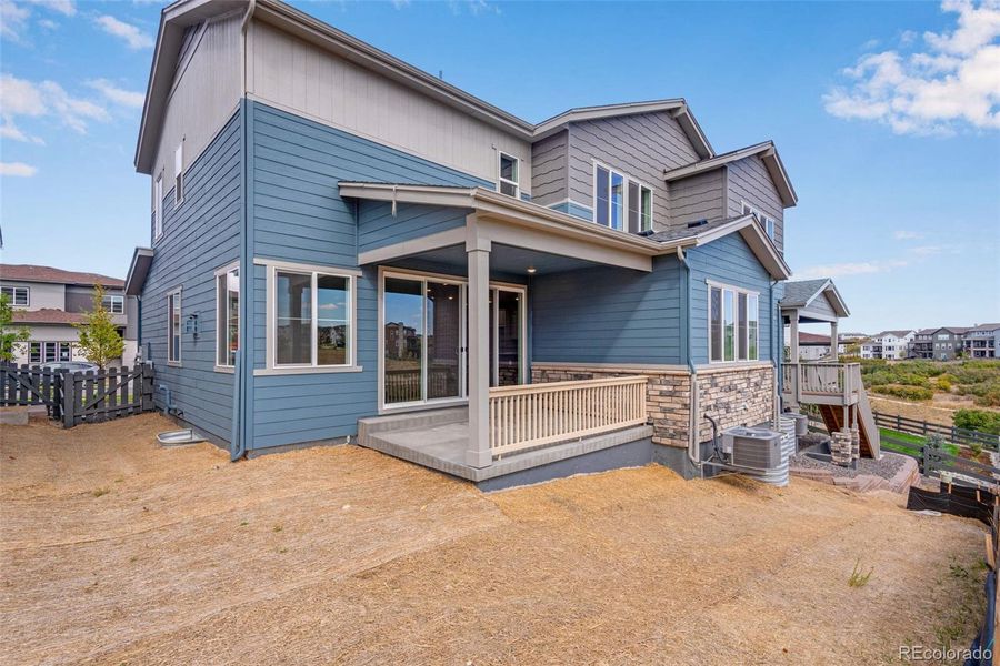 Front exterior of a new home in Wild Oak at The Canyons, Castle Pines, CO, highlighting curb appeal (Image 22). Front exterior of a new home in Wild Oak at The Canyons, Castle Pines, CO, highlighting curb appeal (Image 22).