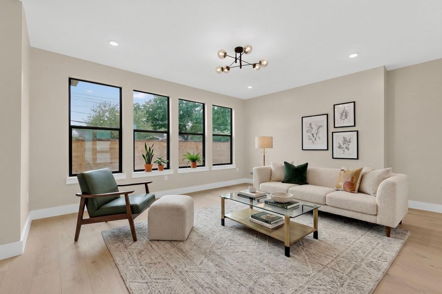 Naturally illuminated interiors highlight beautiful hardwood flooring and expansive windows with serene outdoor views.