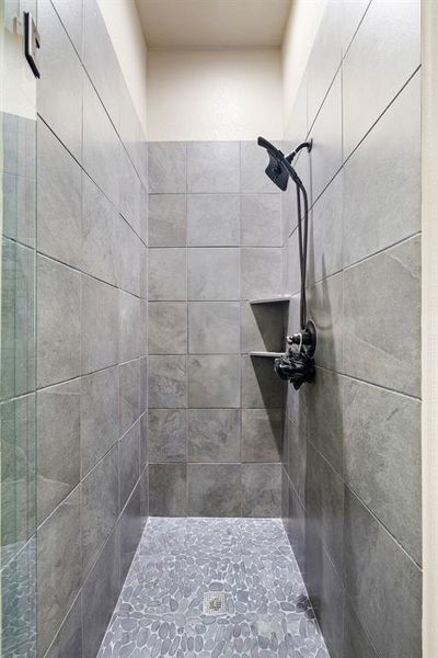 Bathroom featuring tiled shower