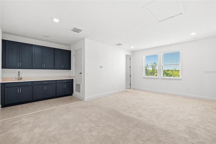 Spacious, unfurnished interior of a new home in Harvest At Ovation 50s, Winter Garden (Image 38).