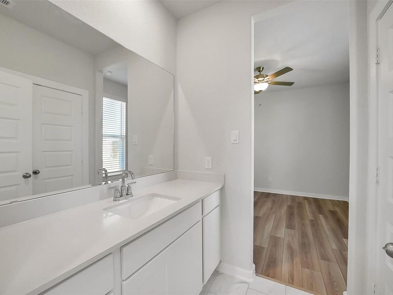 Furnished interior view inside a new home in Sunterra, Katy (Image 17).