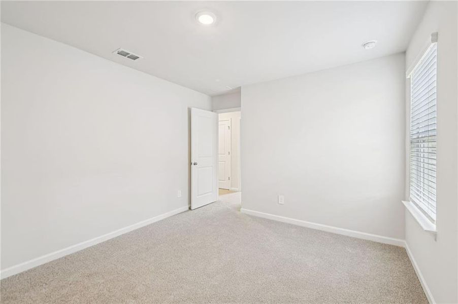 Spacious, unfurnished interior of a new home in Creekside at Oxford Park, Fairburn (Image 62).