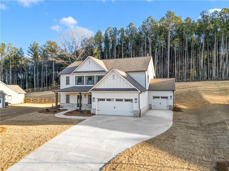 Front exterior of a new home in Red Oak Ridge, Loganville, GA, highlighting curb appeal (Image 19).