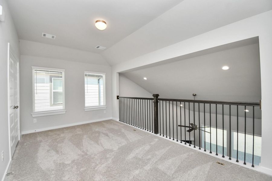 Come upstairs and enjoy a day of leisure in this fabulous game room! This is the perfect hangout spot or adult game room! Features plush carpet, high ceilings, custom paint and windows for plenty of natural light. Come upstairs and enjoy a day of leisure in this fabulous game room! This is the perfect hangout spot or adult game room! Features plush carpet, high ceilings, custom paint and windows for plenty of natural light.