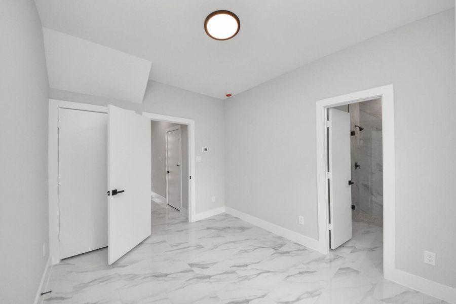 Guest bedroom offering flexibility for office or visitors