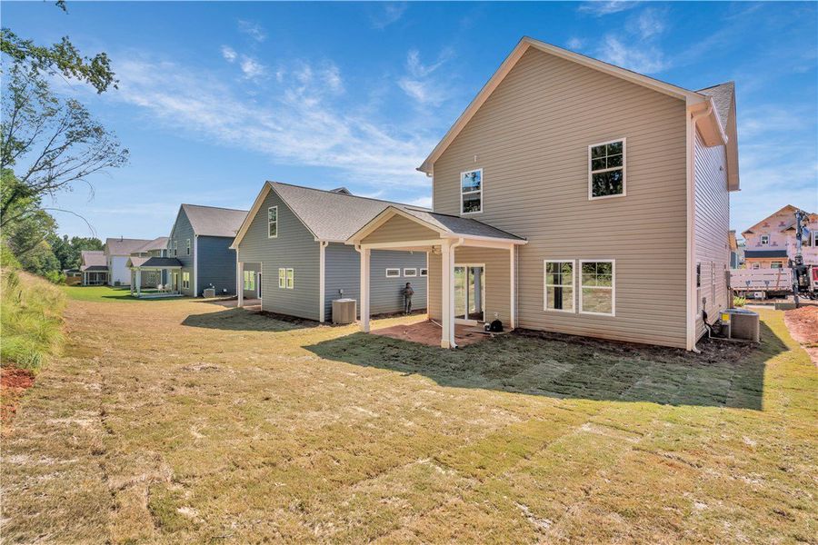 Front exterior of a new home in Brownstone Park, Easley, SC, highlighting curb appeal (Image 2).