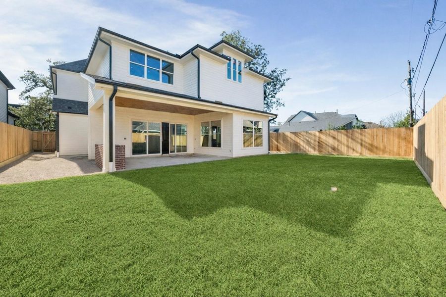 Expansive backyard offering a generous green lawn and plenty of space for entertaining, play, or future pool plans. The covered patio extends the living area outdoors, creating a seamless indoor outdoor flow, while the fully fenced yard provides privacy and room to enjoy everyday living.