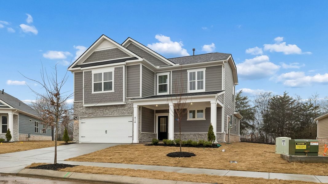 Front exterior of a new home in Harvest Point, Spring Hill, TN, highlighting curb appeal (Image 27).