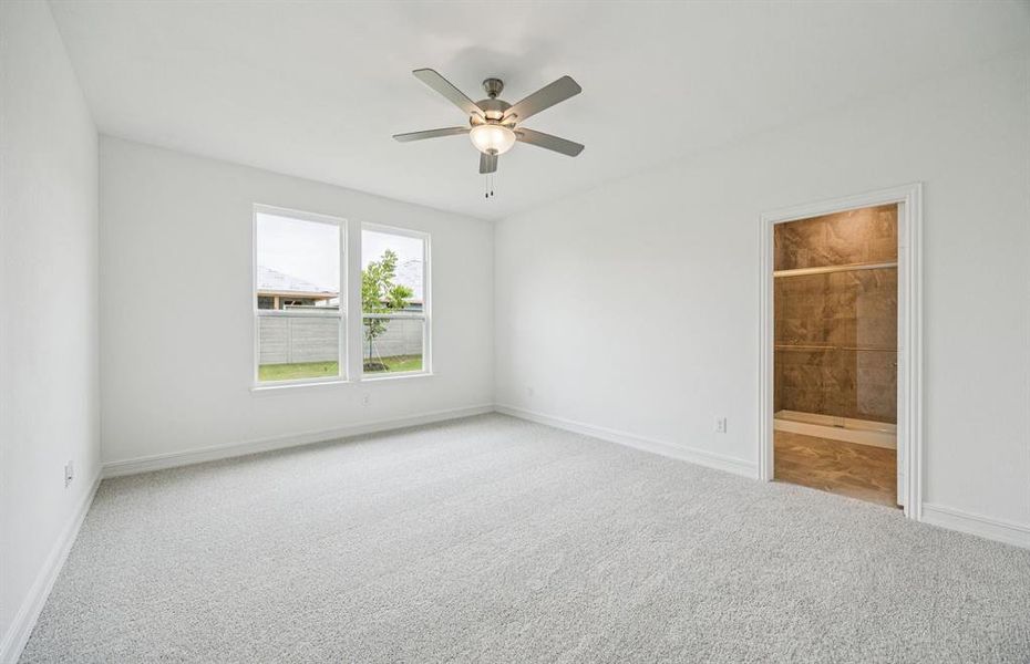 Elegant Owner's suite with beautiful finishes and ample floor space *Real home pictured