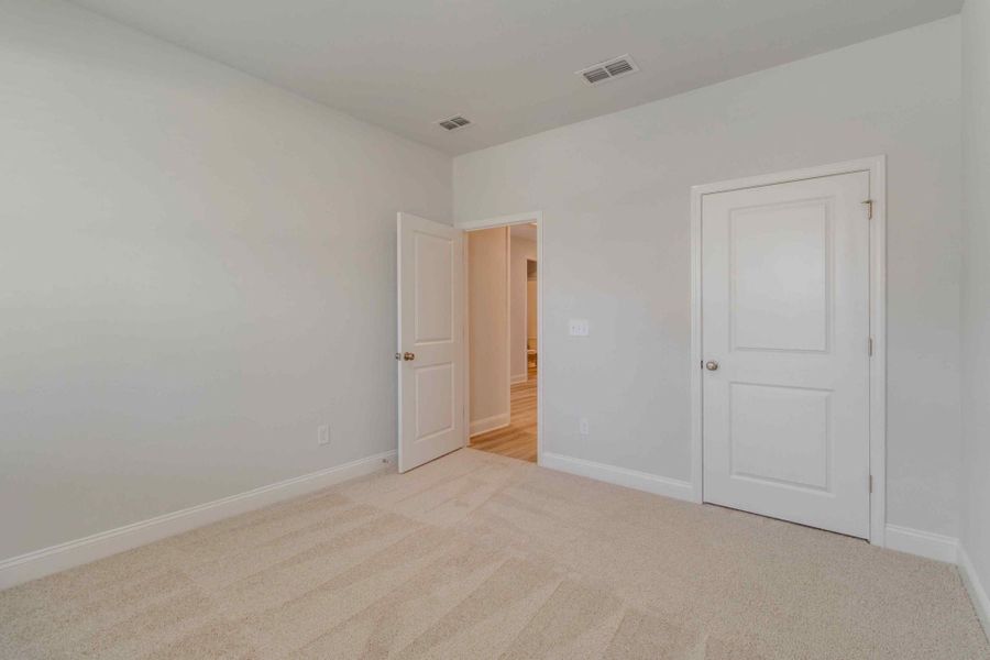 A charming secondary bedroom.