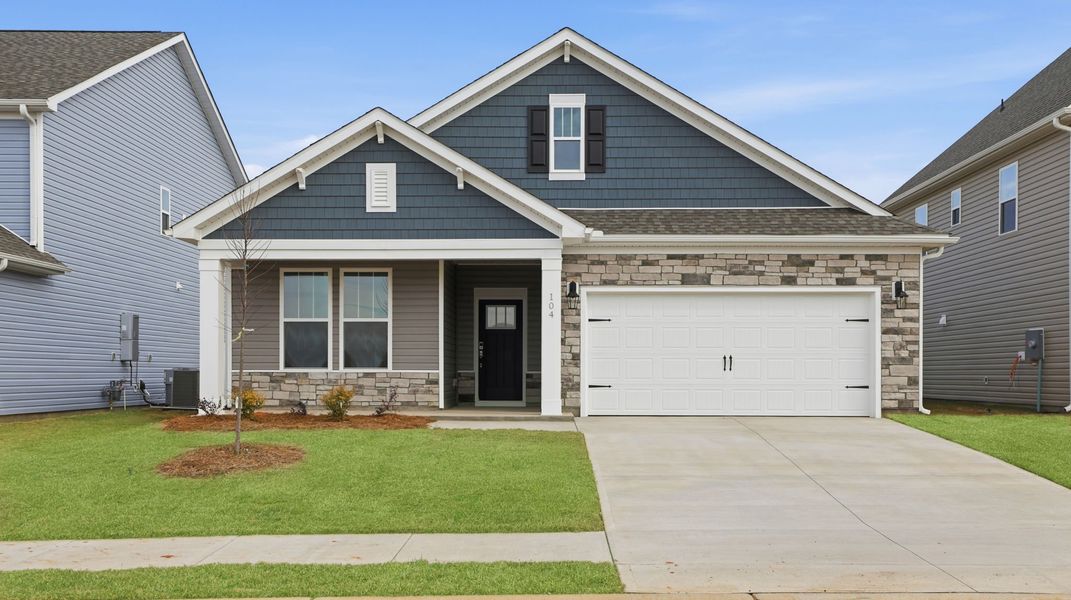 Front exterior of a new home in Cottonwood Ridge, Piedmont, SC, highlighting curb appeal (Image 1). Front exterior of a new home in Cottonwood Ridge, Piedmont, SC, highlighting curb appeal (Image 1).