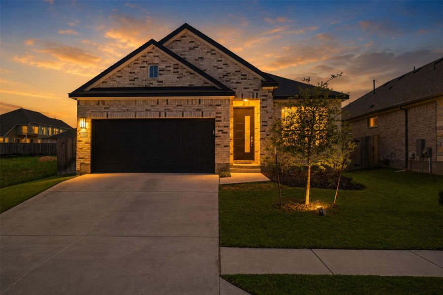 Front exterior of a new home in , Manor, TX, highlighting curb appeal (Image 25).