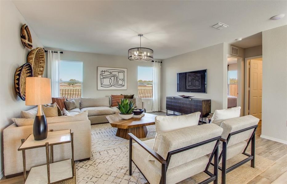 Open concept gathering room creating a spacious and inviting atmosphere *Model representation